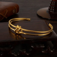 Brățară dublă din oțel inoxidabil placată cu aur 14k, cu nod in mijloc