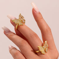 Inel din otel inoxidabil placat cu aur si cristale zirconii in forma de funda