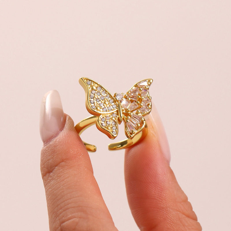 Inel din otel inoxidabil placat cu aur si cristale zirconii in forma de funda