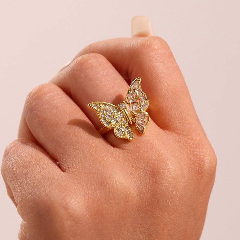 Inel din otel inoxidabil placat cu aur si cristale zirconii in forma de funda