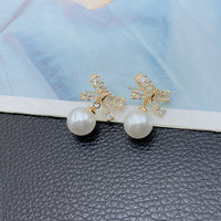 Cercei placati cu aur 14k cu funda din zirconii si perla din cristal