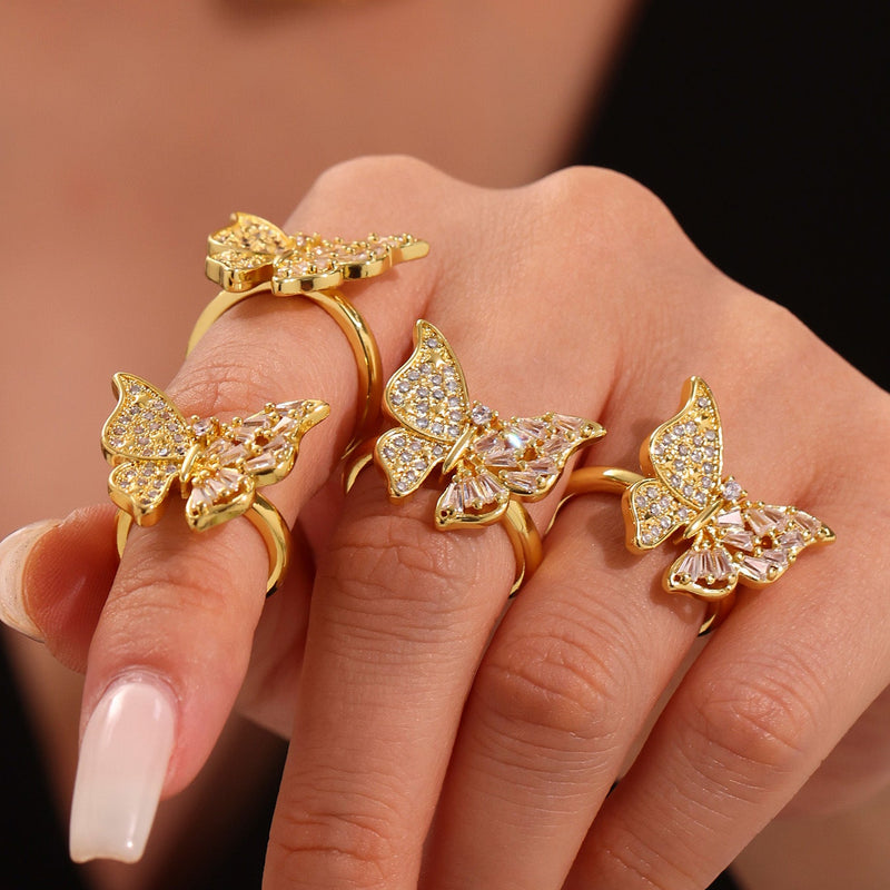 Inel din otel inoxidabil placat cu aur si cristale zirconii in forma de funda