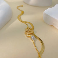 Brățară "Golden Serpent" din otel inoxidabil cu zirconii incrustate